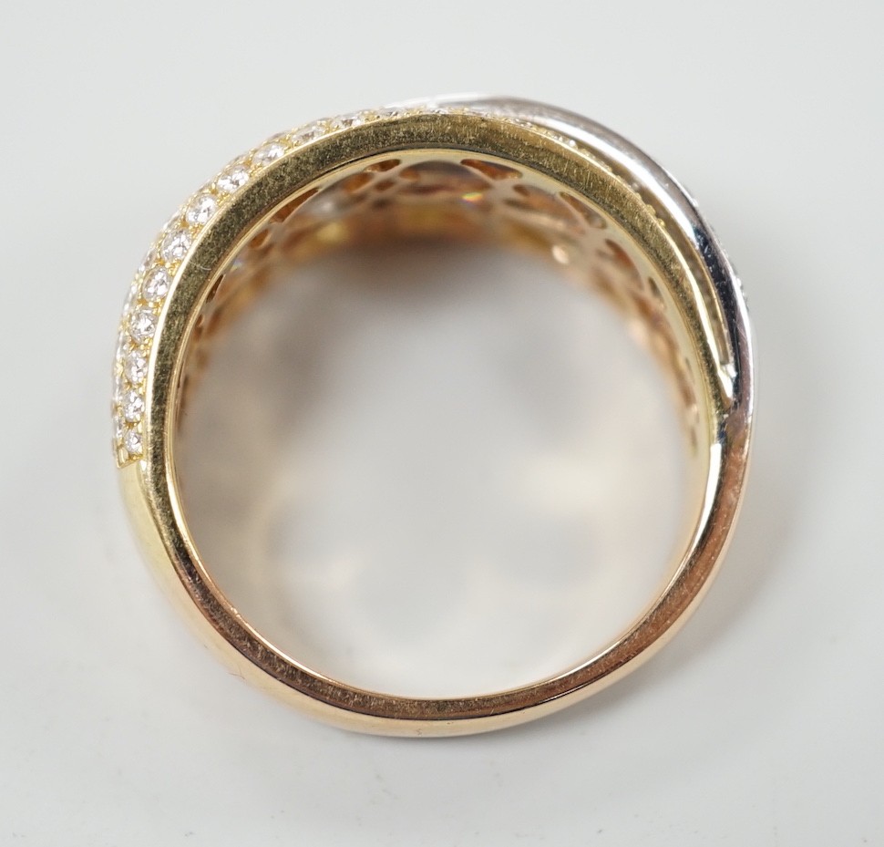 A modern three colour 18ct gold and diamond chip cluster set three row crossover ring, size O, gross weight 6.9 grams.